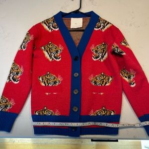 The coolest tiger sweater ever! Size medium. Used but in great shape.
